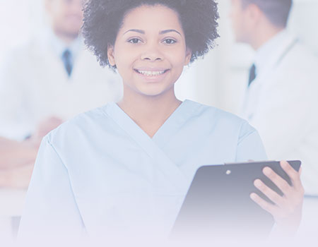 Young black female nurse in blue scrubs holding a tablet representing nursing CEUs online