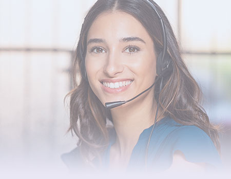 Young female nurse with phone headset smiling and representing telephone triage nursing CEUs