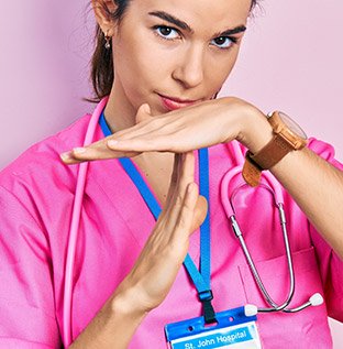 Nurse indicates a timeout with her hands