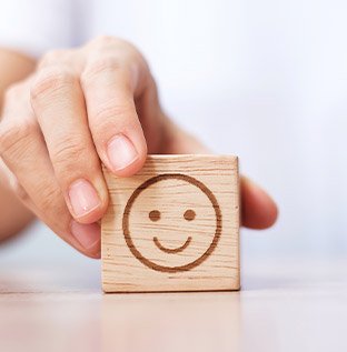Wooden block smiley face