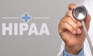 Stethoscope held up to the camera with HIPAA text