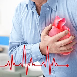 A man suffering a sudden heart attack