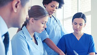 Group of nurses searching online for an answer