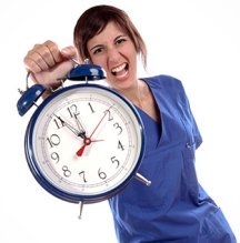 Nurse holding up a clock.