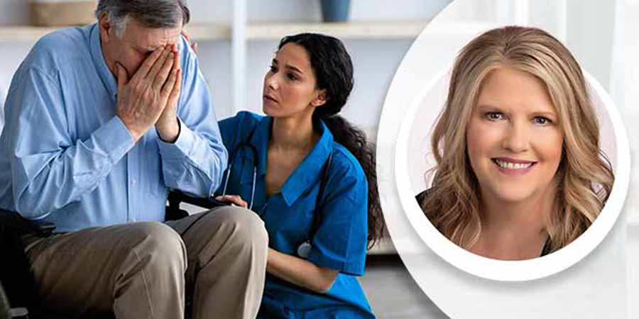 Nurse comforting an elderly man.