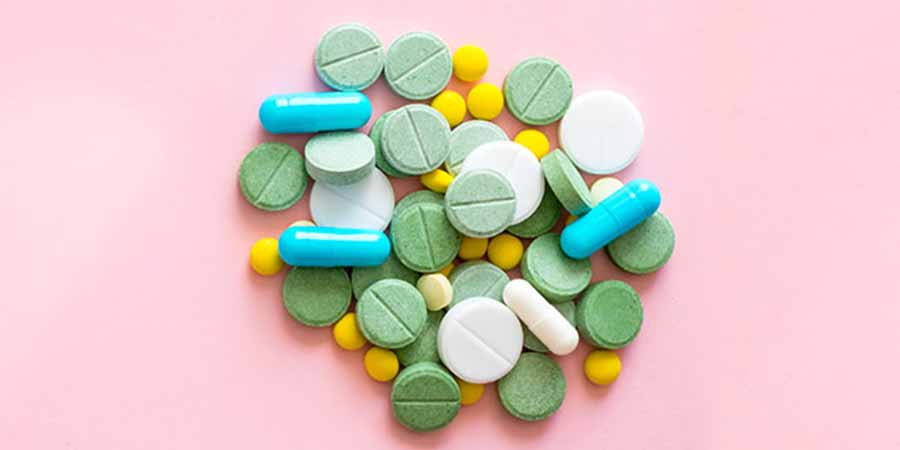 Assorted prescription drugs arranged in a circular design.