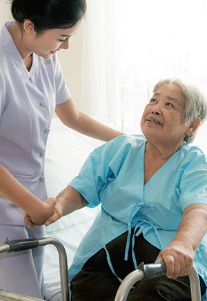 Nurse helping elderly patient