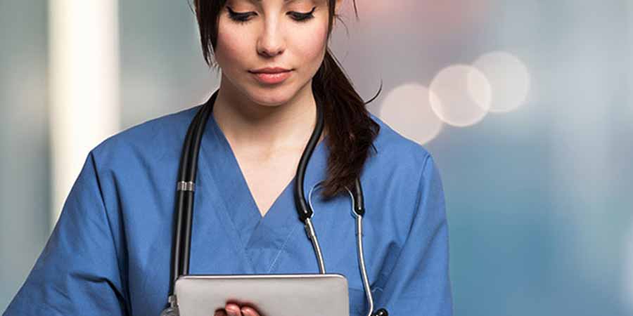 Nurse completing her CEU on a tablet