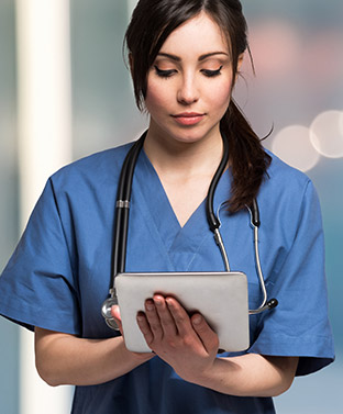 Nurse completing her CEU on her tablet.