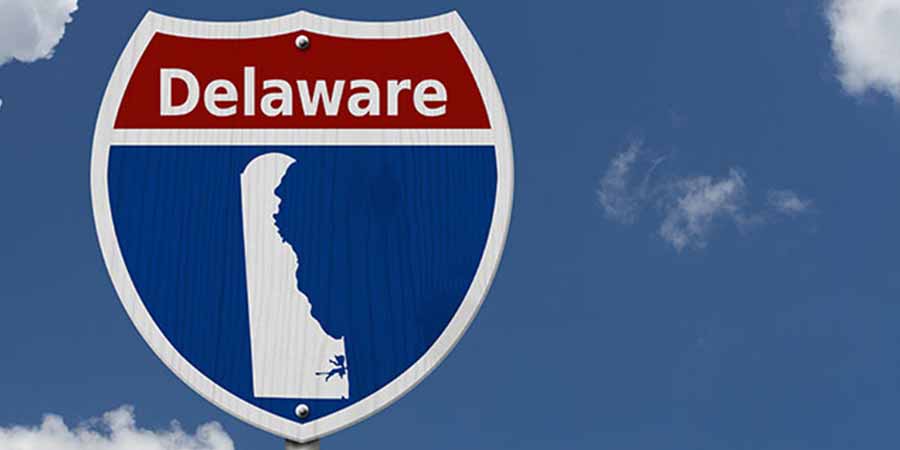 A road sign with Delaware written on it