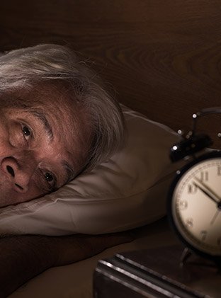 Elderly gentleman finding it hard to leave bed