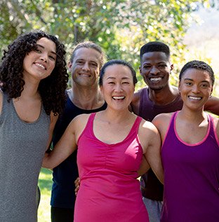 A group of diverse people having a good time outdoors.
