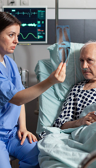 Nurse updating her patient on his health status.