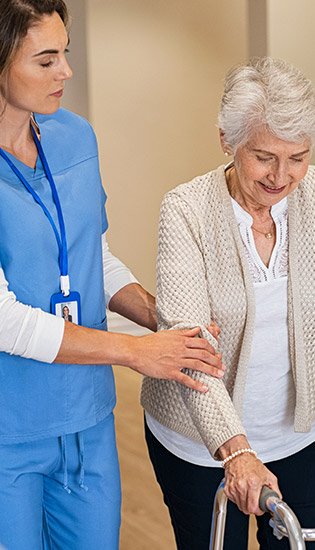 Nurse helping an elderly patient