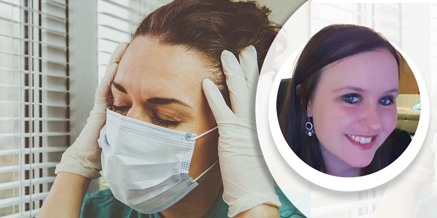Stressed nurse holds her head in her hands