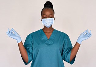 Nurse striking a meditation pose.