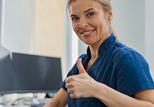 With her plan complete, a nurse gives us a thumbs up.