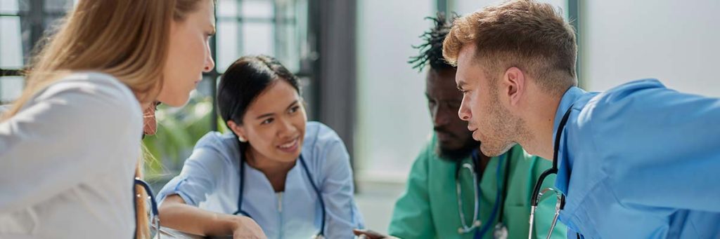 A group of nurses discussing and comparing their plans for the future.