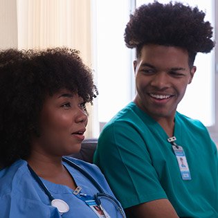 nurses destressing by chatting with each other.