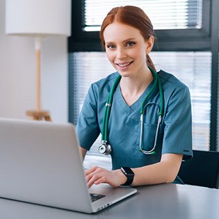 Case Manager nurse working on her laptop.