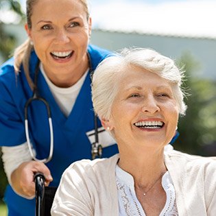 Nurse taking her patient out for a fun stroll.