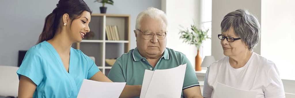 Nurse reviewing medical details with her patients.