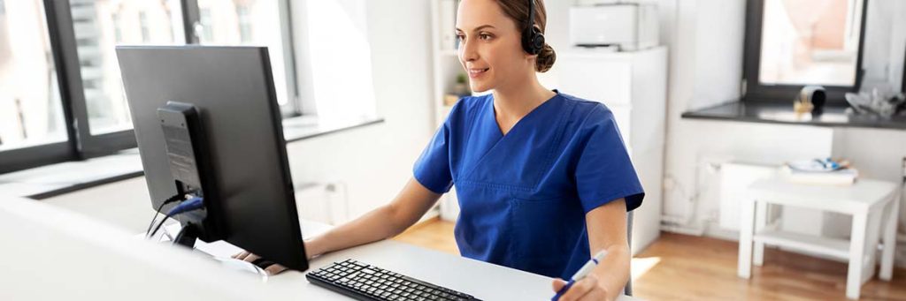 Nurse at work listening to a nursing ceu audio course, a convenient way to take her ceus.