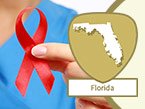 Female nurse in blue scrubs holding a red ribbon representing HIV/AIDS prevention and Florida state outline