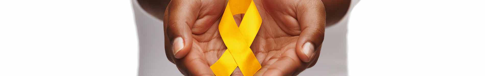 Two hands pointing towards viewer, holding yellow ribbon representing suicide prevention and West Virginia state outline