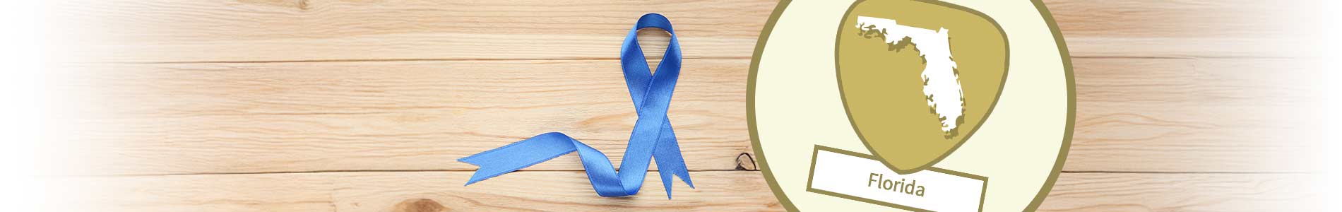 Blue ribbon representing human trafficking on a wooden table and Florida State outline