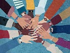 Many different colored hands representing diversity in culture coming together in a circle.