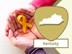 Two hands gently cupped around a yellow ribbon and Kentucky state image