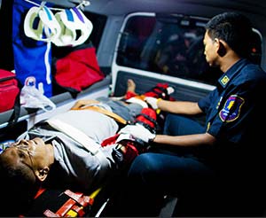 EMT treating patient in an ambulance