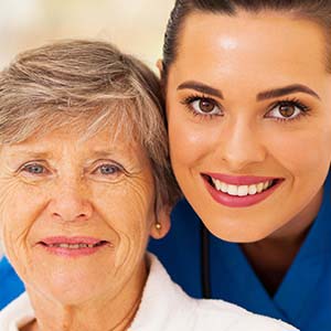 Smiling nurse with an elderly patient Smiling nurse with an elderly patient