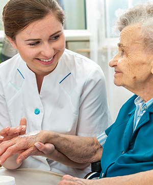 OT cares for an elderly patient